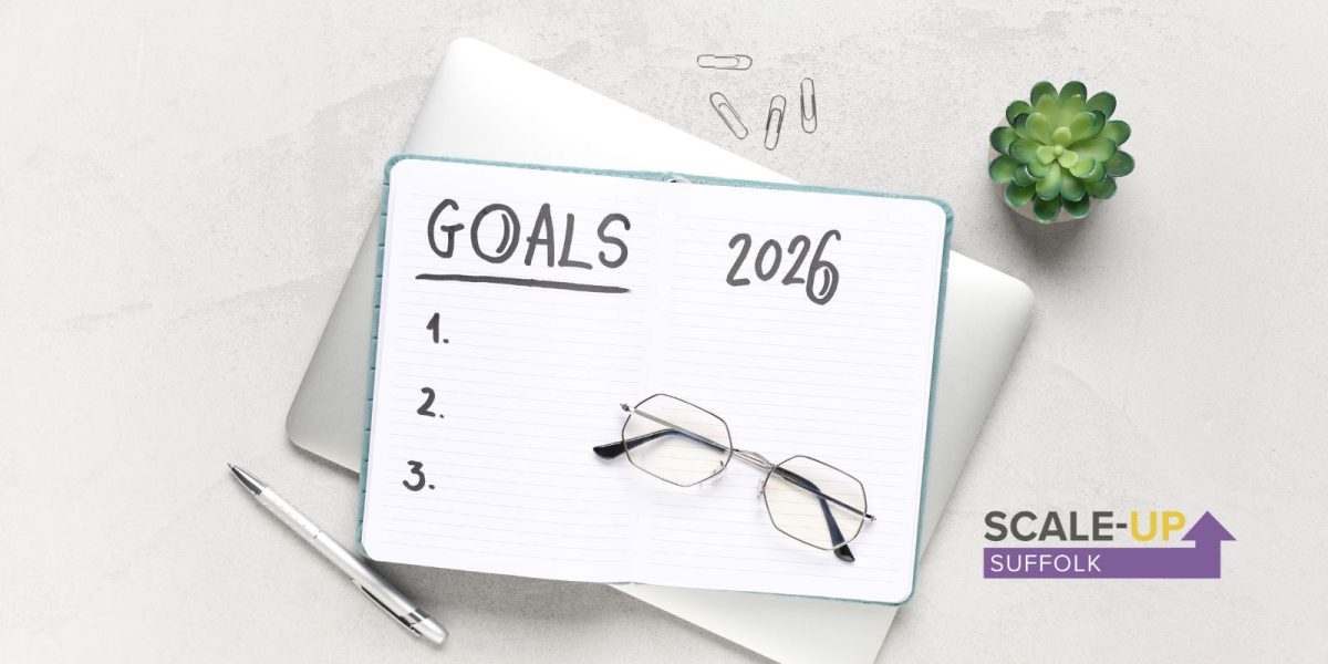 2026 goals written on pad with reading glasses
